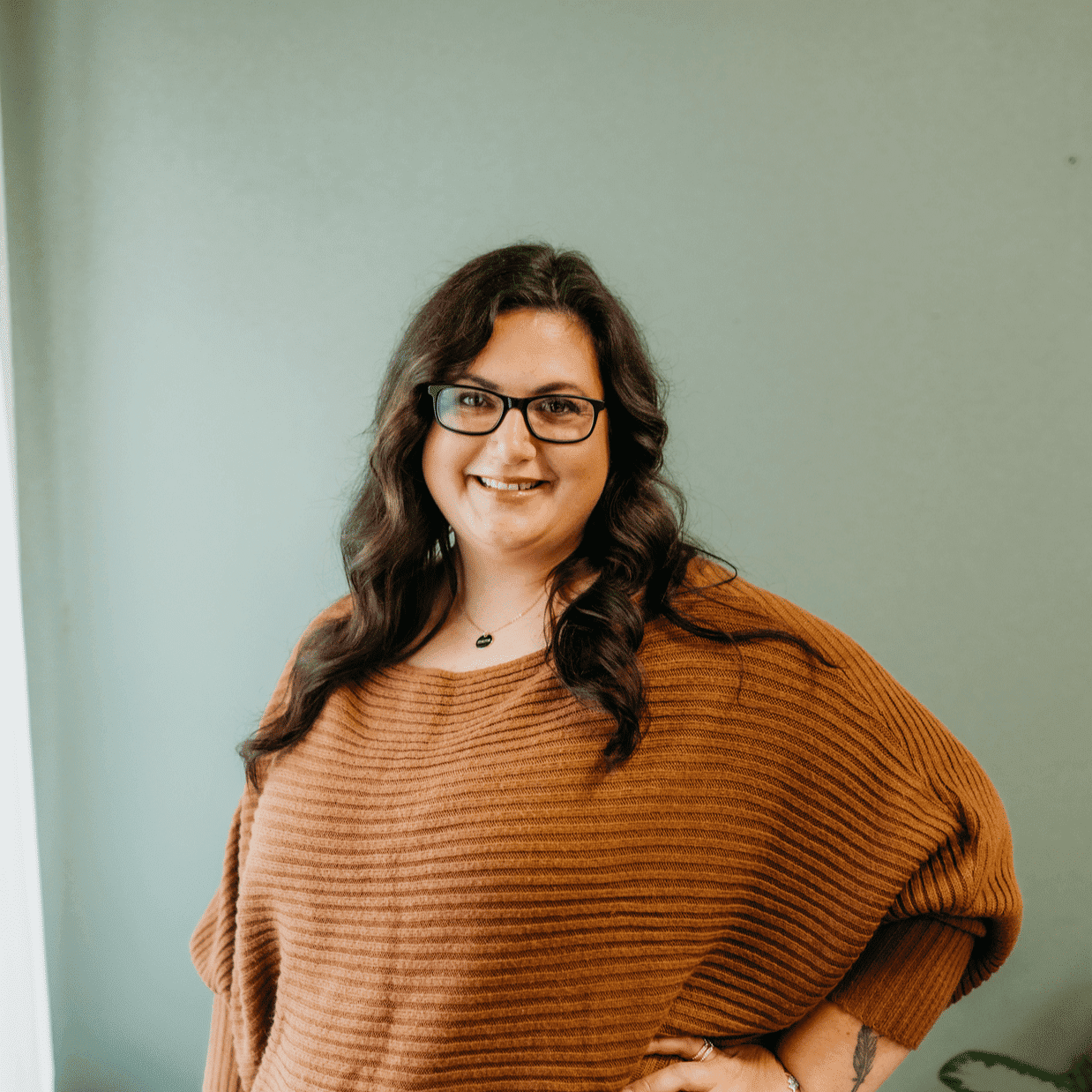 Portrait of Tiffany Utpadel, a professional stylist at Tangles Salon, showcasing their expertise and style.