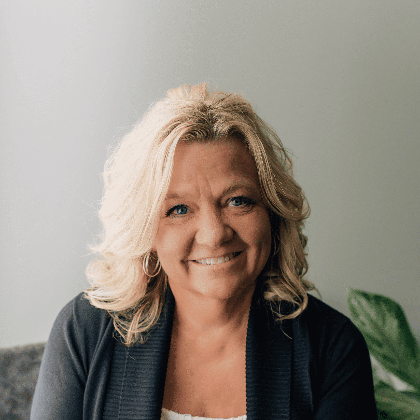 Portrait of Debbie Ranker, a professional stylist at Tangles Salon, showcasing their expertise and style.